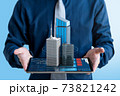Businessman show 3d real estate building for investment on tablet screen. 73821242
