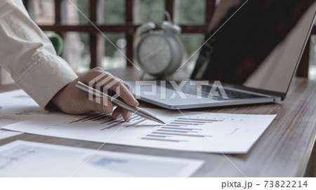 Financial businesswoman calculating corporate income tax data And analyzing charts of financial stocks that are in good condition with growth and progress, Investment in finance and accounting industr 73822214