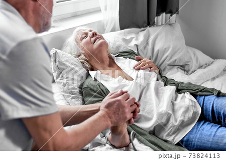 medicine, health safety and pandemic concept - senior man visiting his sick wife medicine, health safety and pandemic concept - senior man visiting his sick wife 73824113