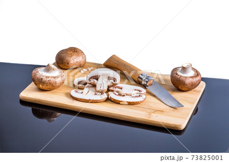 Royal champignons mushrooms on wooden board with copy space Royal champignons mushrooms on wooden board with copy space 73825001