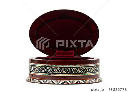 Wooden box with ornaments for jewelry and bijoux on a white background Wooden box with ornaments for jewelry and bijoux on a white background 73826778