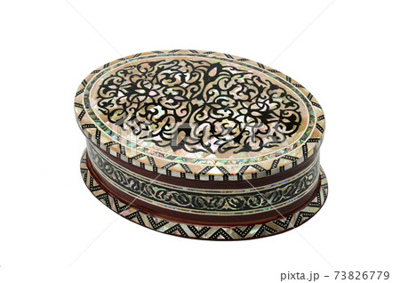 Wooden box with ornaments for jewelry and bijoux on a white background 73826779
