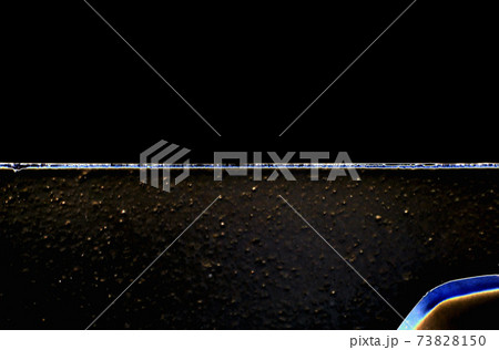 Macrophotography. Abstract background of horizontal stripes of dark color. Rough and smooth Macrophotography. Abstract background of horizontal stripes of dark color. Rough and smooth 73828150