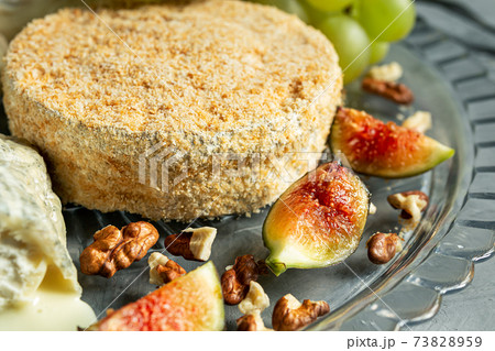 French cheese with grapes, walnuts and figs 73828959