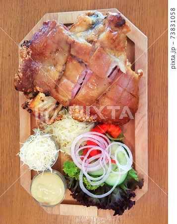 grilled pork shank with vegetable side dish and sauce, restaurant, Czech cuisine. Prague. grilled pork shank with vegetable side dish and sauce, restaurant, Czech cuisine. Prague. 73831058