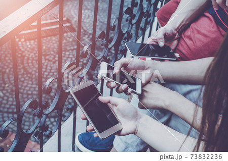 Close up of men hands holding touching mobile phone with blank copy space for your text message in cafe Close up of men hands holding touching mobile phone with blank copy space for your text message in cafe 73832236