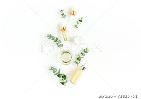Eucalyptus essential oil, eucalyptus leaves on white background. Natural, Organic cosmetics products. Medicinal, Natural Serums. Flat lay, top view. 73835751