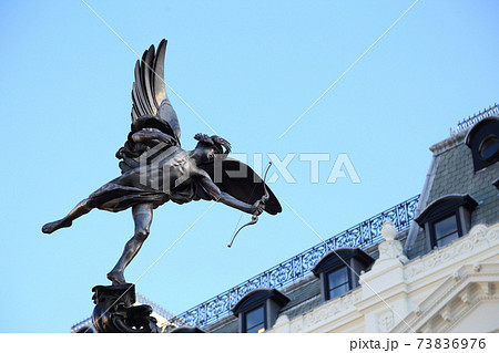 Shaftesbury Memorial Fountain, statue of a mythological figure Anteros (Eros 's brother) with blue sky background, Piccadilly Circus, London, United Kingdom. Shaftesbury Memorial Fountain, statue of a mythological figure Anteros (Eros 's brother) with blue sky background, Piccadilly Circus, London, United Kingdom. 73836976