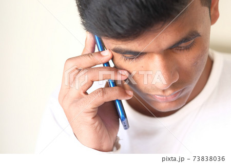 Close up of young man hand using smart phone. 73838036