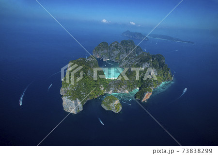 Top view of isolated rocky tropical island with turquoise water and white beach. 73838299