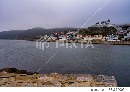 Ocean with mountains in fog in the background. Picture from Molle, Scania, Sweden 73840064