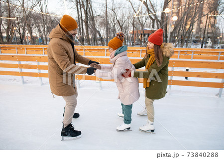 Teaching child to skate Teaching child to skate 73840288
