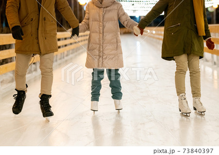 Family with child skating 73840397