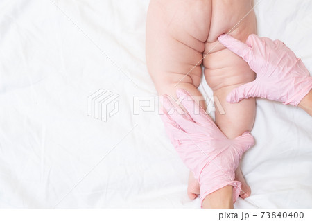 examination of the baby by a pediatrician on a white background 73840400