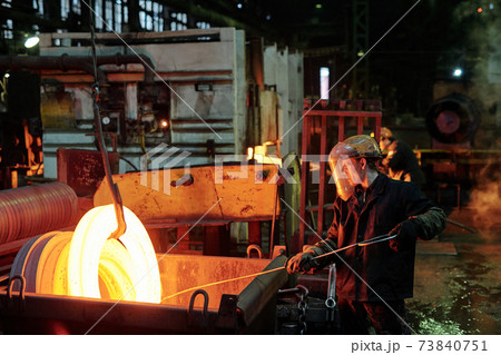 Worker melting metal 73840751