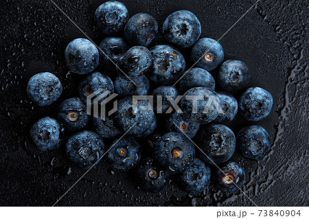 Fresh natural antioxidant blueberries pile, macro detailed close up Fresh natural antioxidant blueberries pile, macro detailed close up 73840904