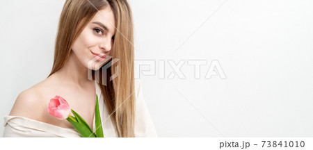 Woman with one pink tulip 73841010