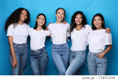Diverse Females Group Smiling Posing In Studio On Blue Background 73841340