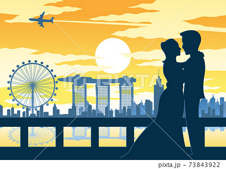 couple hug together at the landmark of Singapore on sunset time,vintage color 73843922