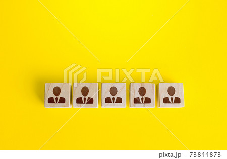 Blocks with employees in a row. Building a business team from many candidates. Personnel management, team formation for a new project. Cooperation and collaboration. Hiring and recruiting workers. 73844873
