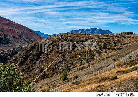 View of the mountains around Alpe d'Huez in the french Alps, France 73844899