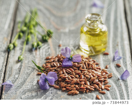 Flax seeds and flaxseed oil with copy space 73844973