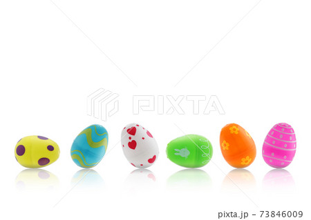 Easter toy eggs on white with reflection 73846009