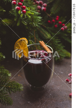 Still life Christmas hot drink among fir tree branches 73847616