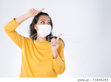 happy Asian woman wearing hygienic mask 73849294
