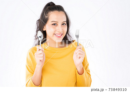 Asian woman showing Knife Fork prepare to eat food Asian woman showing Knife Fork prepare to eat food 73849310