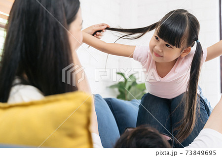 Happy little girl daughter playing with father Happy little girl daughter playing with father 73849695