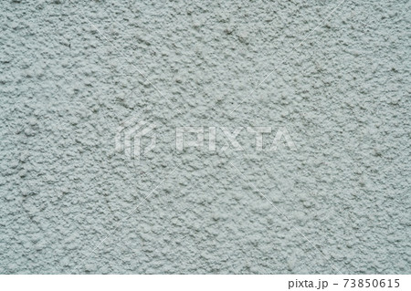Light plastered wall with defects texture close up 73850615