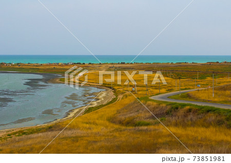 The road between the mud lake and the sea The road between the mud lake and the sea 73851981