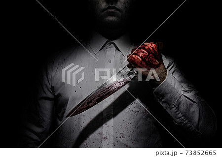 Killer in white shirt holding a bloody knife. Killer in white shirt holding a bloody knife. 73852665