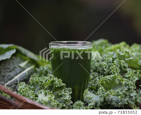A healthy vegan drink green kale smoothie A healthy vegan drink green kale smoothie 73855052