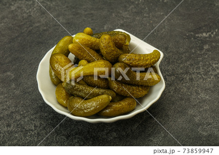 Pickled gherkin in the bowl 73859947