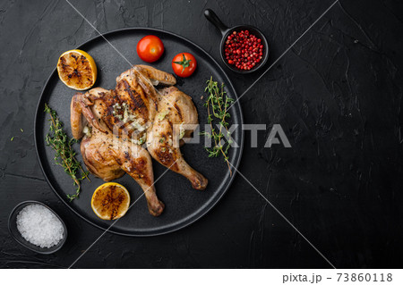 Fried chicken meat, on black background, top view with copy space for text 73860118