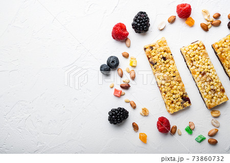 Energy bars snack, flat lay with space for text, on white background Energy bars snack, flat lay with space for text, on white background 73860732