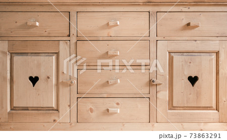 Rustic cupboard door with an engraved heart 73863291