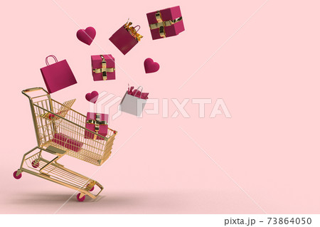 Gifts and shopping bags fly away from golden shopping cart on pink background 73864050