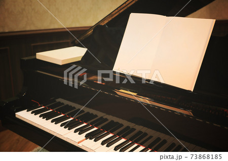 Close up of Piano keys with blank music sheet, toned image processed with filtered vintage effect. 73868185