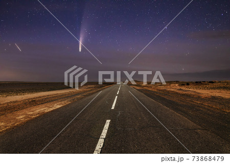 Comet over the old asphalt road in the desert. 73868479