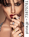 Fashion portrait in warm colors. Studio shooting. 73870781