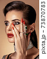 Fashion portrait in warm colors. Studio shooting. 73870783