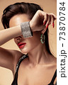Fashion portrait in warm colors. Studio shooting. 73870784