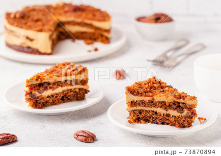 Vegan homemade carrot cake with pecans. Vegan homemade carrot cake with pecans. 73870894
