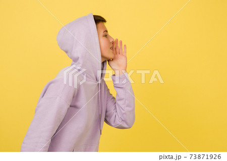 Caucasian girl's portrait isolated on yellow studio background with copyspace Caucasian girl's portrait isolated on yellow studio background with copyspace 73871926