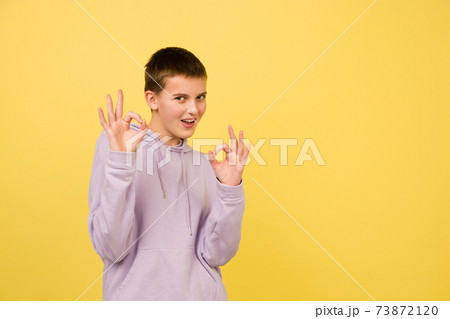 Caucasian girl's portrait isolated on yellow studio background with copyspace 73872120