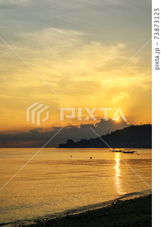 Views of the beach and the ocean at sunrise. Views of the beach and the ocean at sunrise. 73873125