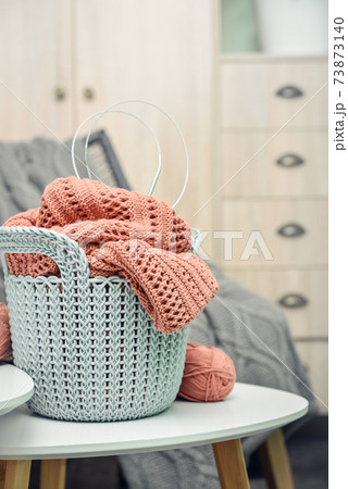 Basket with knitting project in progress 73873140